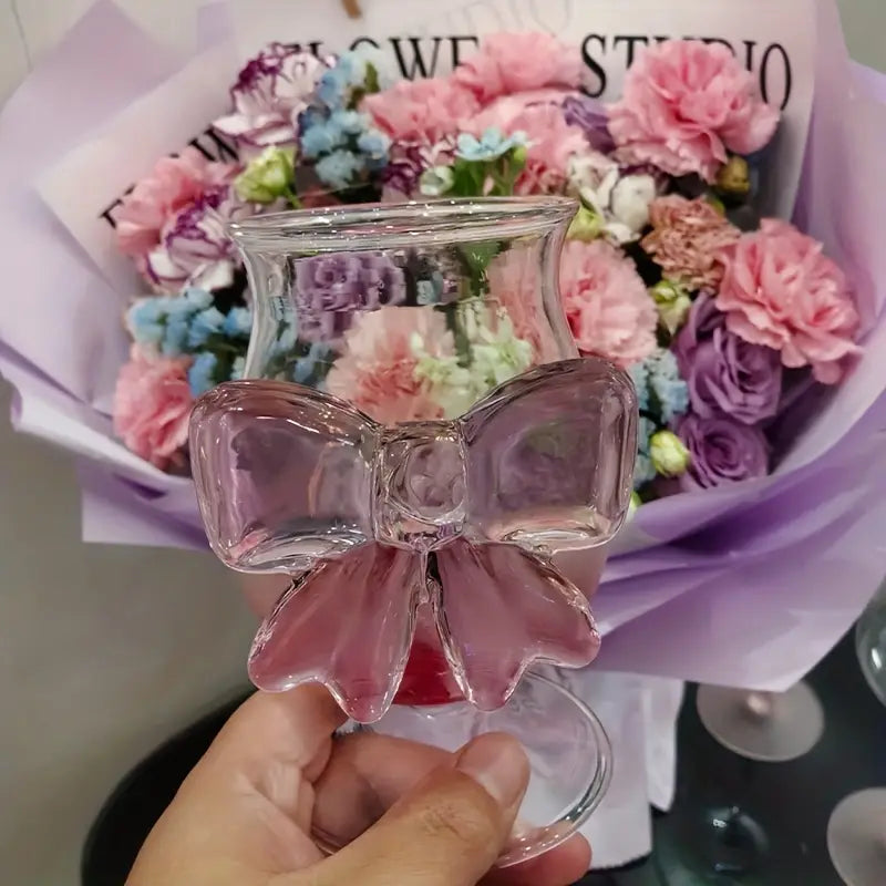 Bouquet of flowers with a decorative glass bow in front
